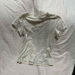 White shirt with green purple flowers and green steams